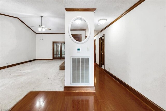 206 Swaim Ct, Salisbury, NC 28147 - hallway with crown molding, baseboards, carpet flooring, wood finished floors, and lofted ceiling