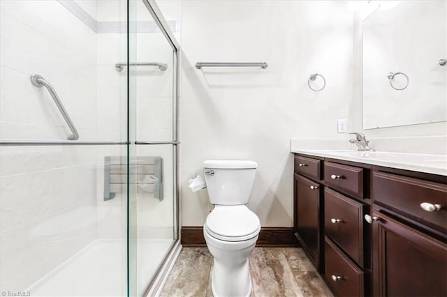 206 Swaim Ct, Salisbury, NC 28147 - bathroom featuring a tile shower, vanity, toilet, and baseboards