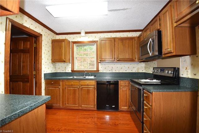 kitchen with sink, stainless steel appliances, dark hardwood / wood-style flooring, crown molding, and a textured ceiling