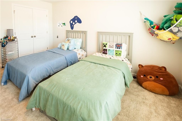 carpeted bedroom with a closet