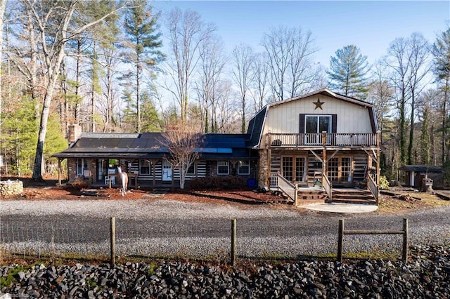 view of front of property with solar panels and a porch