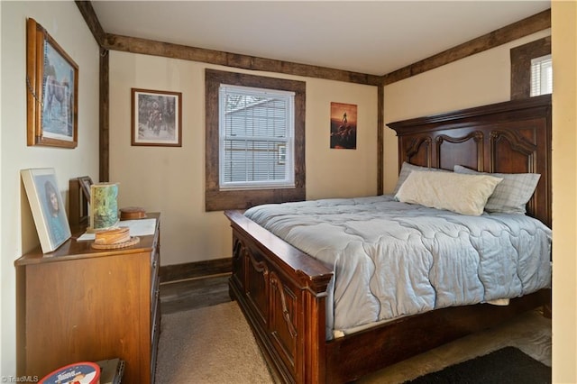 bedroom featuring dark carpet