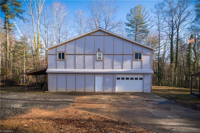 view of front of property featuring a carport and a garage