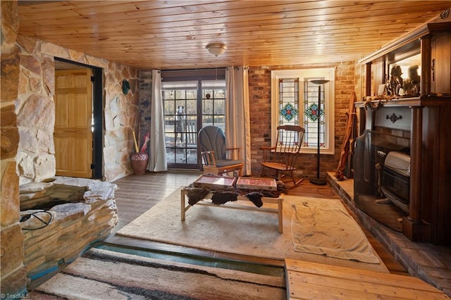 sitting room featuring hardwood / wood-style flooring and wooden ceiling