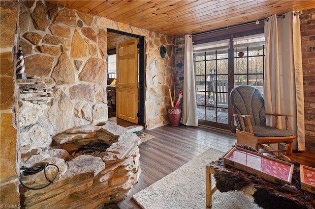 living area featuring hardwood / wood-style flooring and wooden ceiling