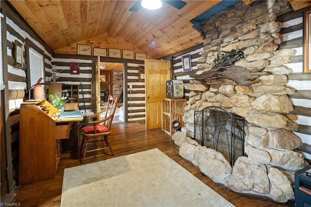 office with a stone fireplace, vaulted ceiling, dark hardwood / wood-style floors, ceiling fan, and wood ceiling