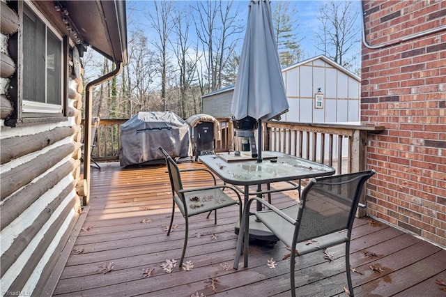 wooden terrace featuring grilling area