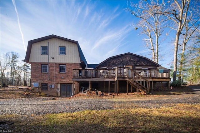 back of property with a wooden deck