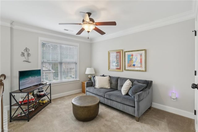 carpeted living room featuring visible vents, baseboards, ornamental molding, and a ceiling fan