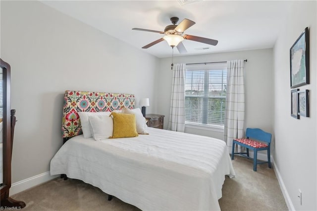 bedroom featuring baseboards, carpet, and a ceiling fan