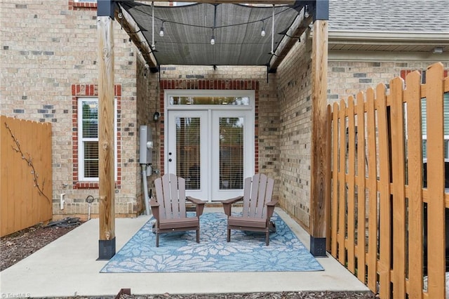 view of patio / terrace featuring fence