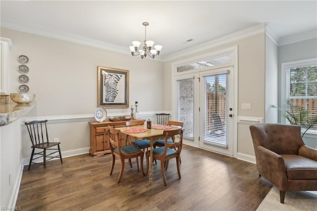 dining area featuring baseboards, visible vents, dark wood finished floors, ornamental molding, and a notable chandelier