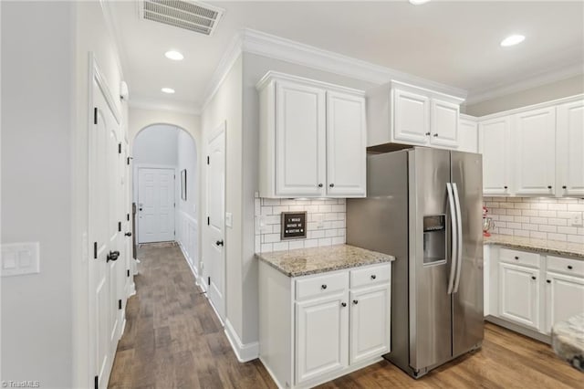 kitchen featuring dark wood-style floors, visible vents, white cabinetry, and stainless steel refrigerator with ice dispenser