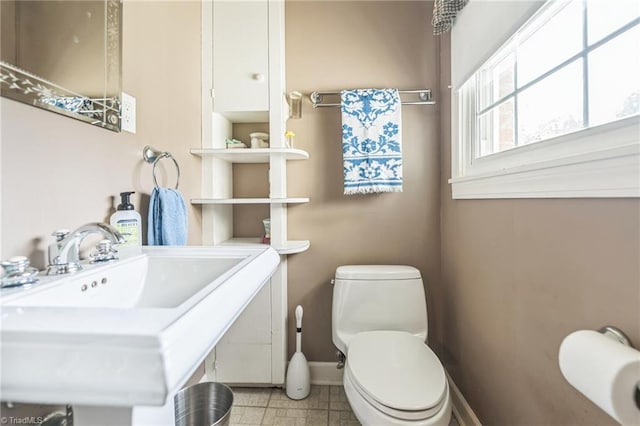 bathroom featuring toilet and sink