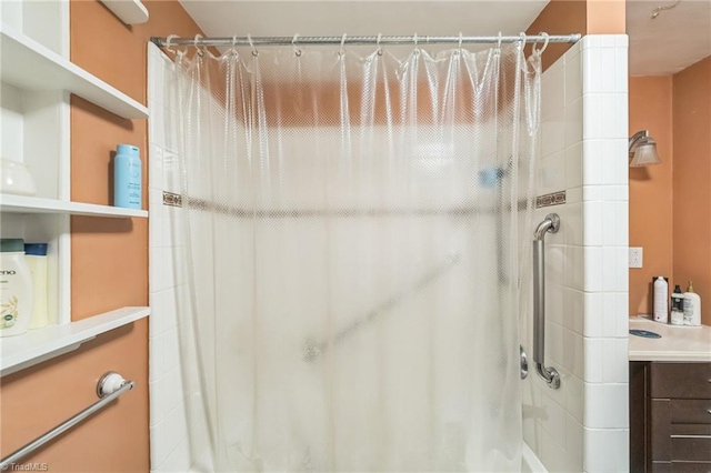 bathroom with a shower with curtain and vanity