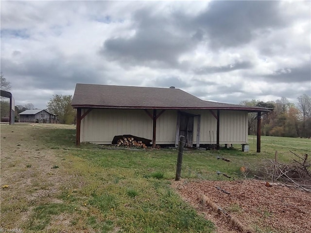 345 Anderson Rd, Eden, NC 27288 - view of side of property featuring a pole building, an outdoor structure, and a lawn