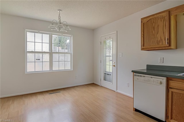 261 Williamsgate Ct, Winston-Salem, NC 27107 - kitchen featuring white dishwasher, a chandelier, light wood-style floors, dark countertops, and a textured ceiling