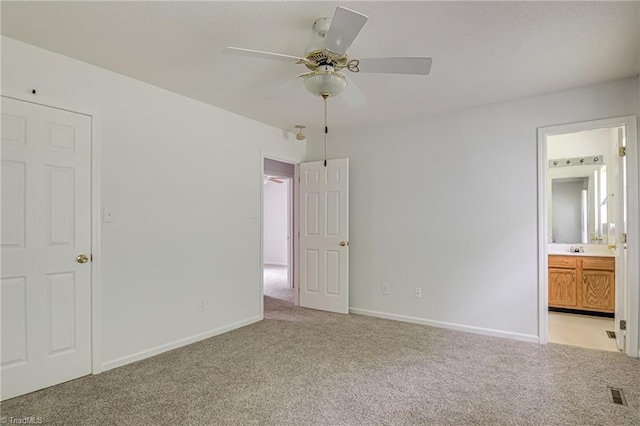 261 Williamsgate Ct, Winston-Salem, NC 27107 - unfurnished bedroom featuring light colored carpet, baseboards, connected bathroom, and ceiling fan