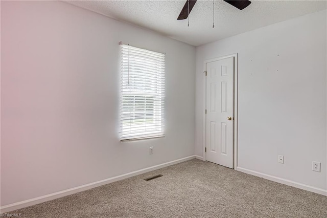 261 Williamsgate Ct, Winston-Salem, NC 27107 - spare room featuring ceiling fan, light carpet, baseboards, and a textured ceiling