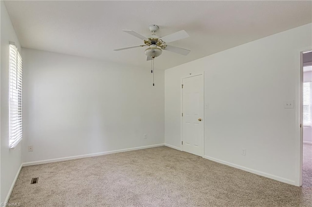 261 Williamsgate Ct, Winston-Salem, NC 27107 - spare room with carpet floors, a ceiling fan, and baseboards