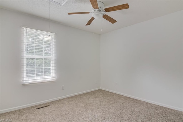 261 Williamsgate Ct, Winston-Salem, NC 27107 - carpeted spare room featuring attic access, baseboards, and a ceiling fan