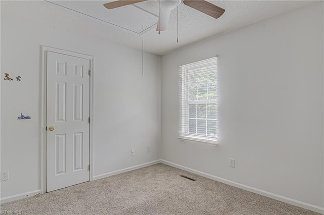 261 Williamsgate Ct, Winston-Salem, NC 27107 - carpeted empty room with attic access, a ceiling fan, baseboards, and a textured ceiling