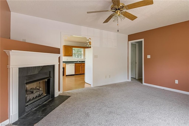 261 Williamsgate Ct, Winston-Salem, NC 27107 - unfurnished living room with light carpet, ceiling fan, a fireplace with flush hearth, a textured ceiling, and baseboards