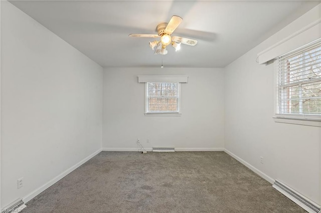 carpeted spare room featuring a ceiling fan, baseboards, and visible vents