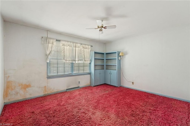 spare room with a ceiling fan, baseboards, and carpet floors