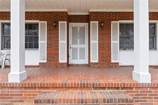 entrance to property with brick siding