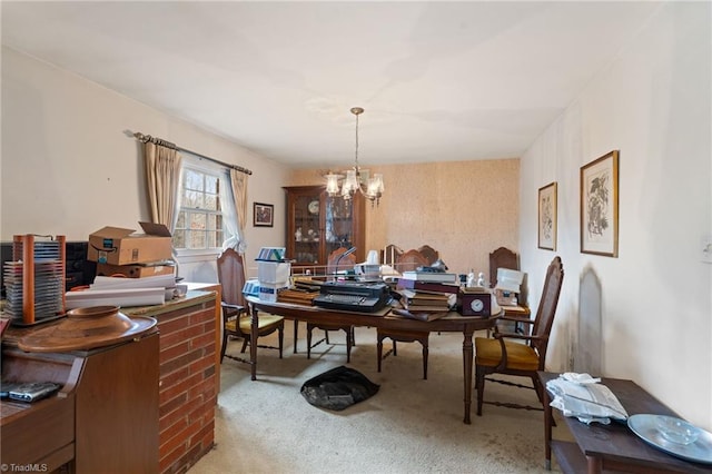 dining room featuring a notable chandelier and carpet flooring