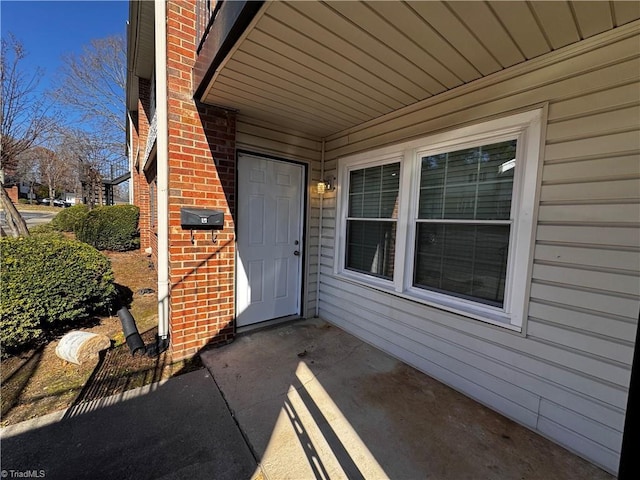 doorway to property featuring a patio