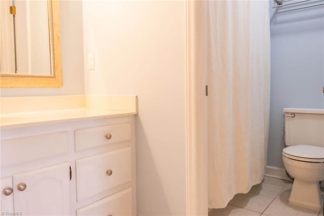 bathroom with tile patterned floors, toilet, and vanity