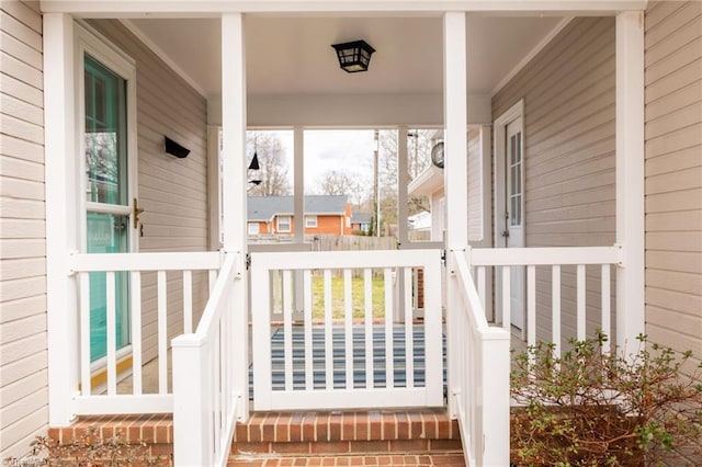 property entrance featuring covered porch