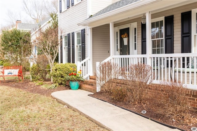 property entrance featuring covered porch