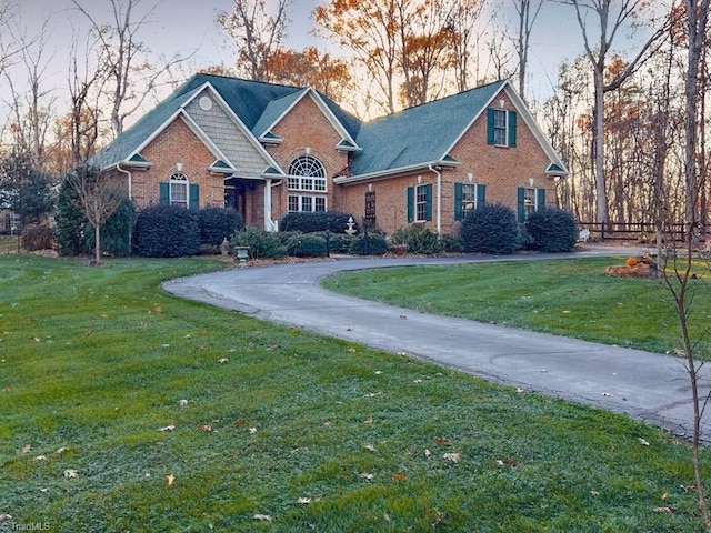 view of front of house with a lawn