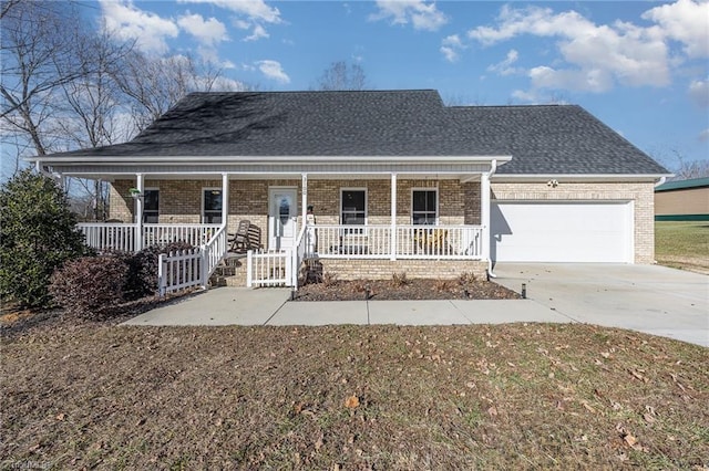 view of front facade with covered porch and a garage