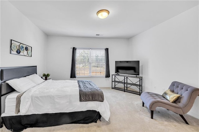 bedroom featuring light carpet