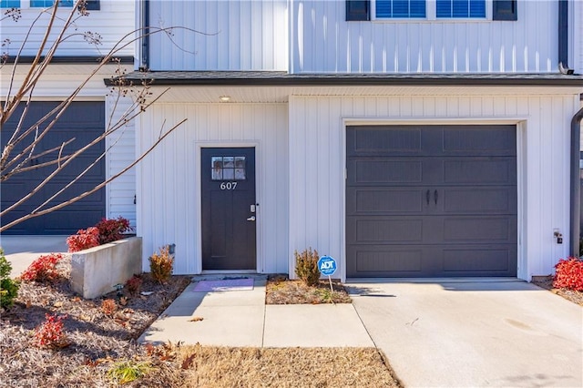 view of exterior entry featuring a garage