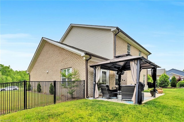 back of property featuring a gazebo, a patio area, outdoor lounge area, fence, and brick siding