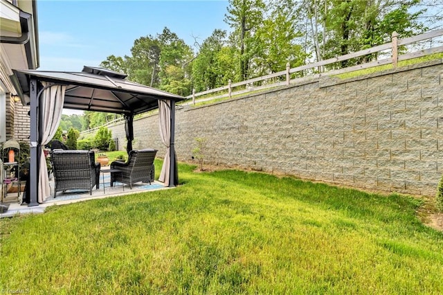 view of yard with fence, a gazebo, a patio area, and an outdoor living space