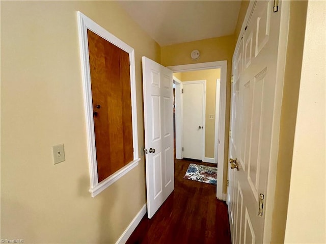 hall with dark wood-type flooring