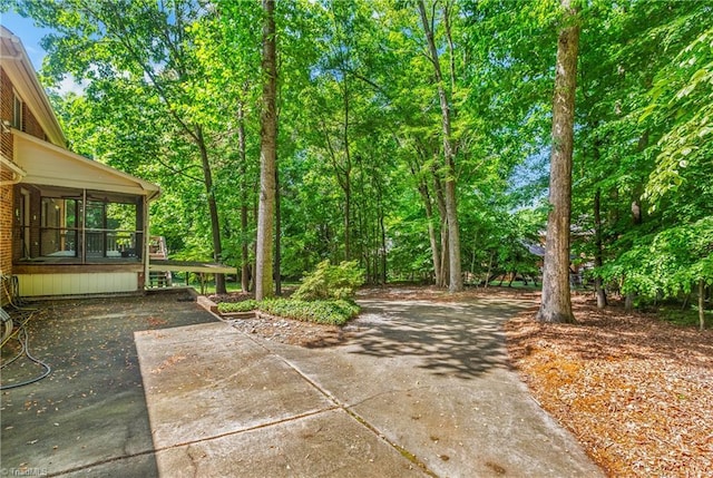 view of patio / terrace featuring concrete driveway