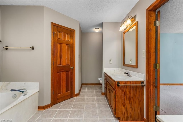 full bath featuring a textured ceiling, toilet, baseboards, a bath, and vanity