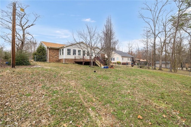 view of yard with a wooden deck