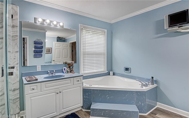 bathroom featuring vanity, a relaxing tiled tub, ornamental molding, and wood-type flooring