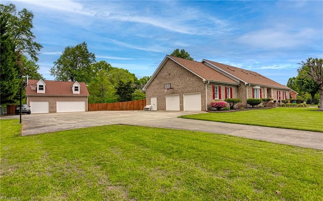 view of front facade with a front lawn and a garage