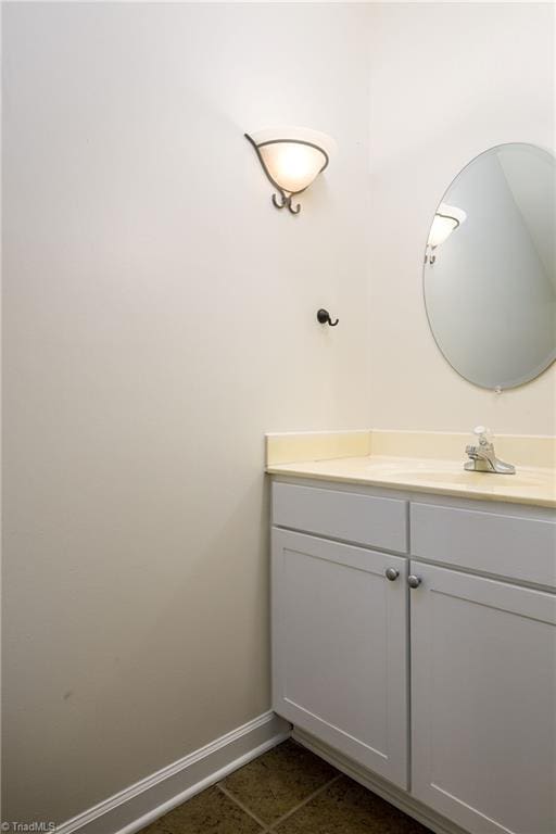 3820 Wayfarer Dr, Greensboro, NC 27410 - bathroom with vanity, baseboards, and tile patterned flooring