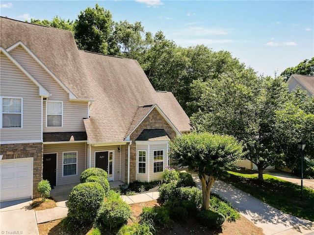 3820 Wayfarer Dr, Greensboro, NC 27410 - view of front of property with stone siding and roof with shingles