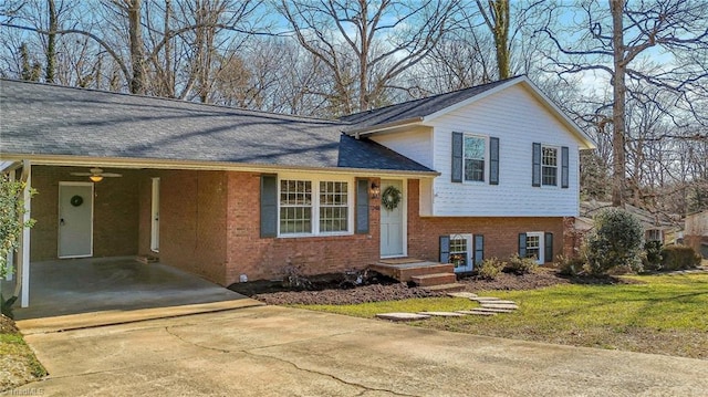 view of front of property with a front yard and a carport